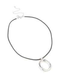 Crafted from waterproof stainless steel with an organic pendant on a black cord necklace front view - link has visual effect only