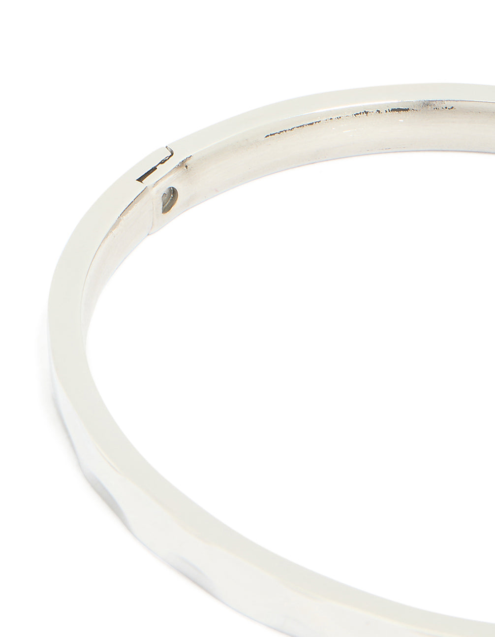Crafted from waterproof stainless steel with hammered hinged mechanism in silver and statement aesthetic closure detail view