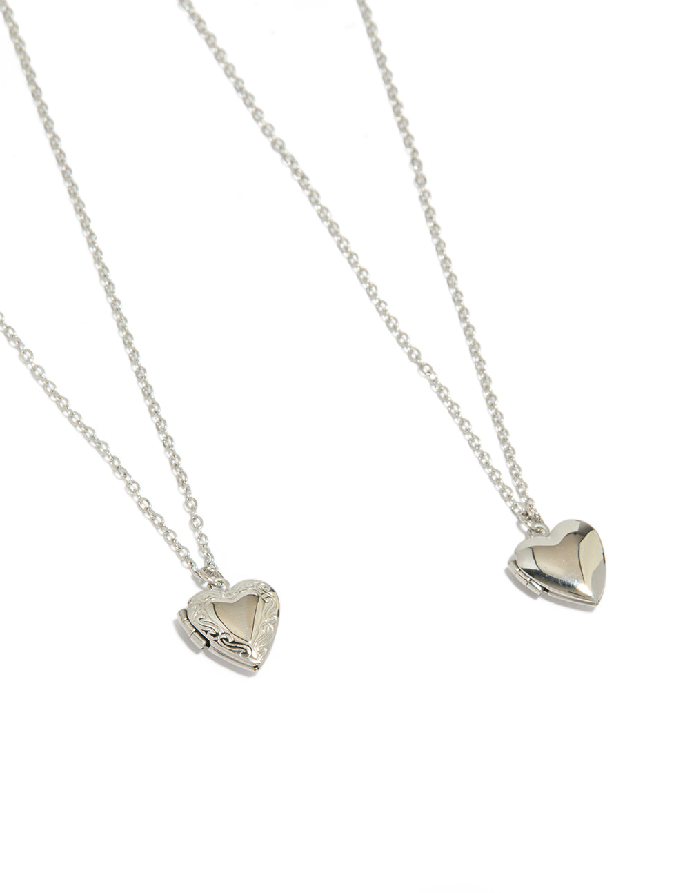 Featuring heart locket pendant necklaces crafted from waterproof stainless steel in silver, available as a 2-pack close up view