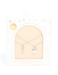 A waterproof stainless steel key and heart lock layered necklace with padlock pendant in silver on neck view - link has visual effect only