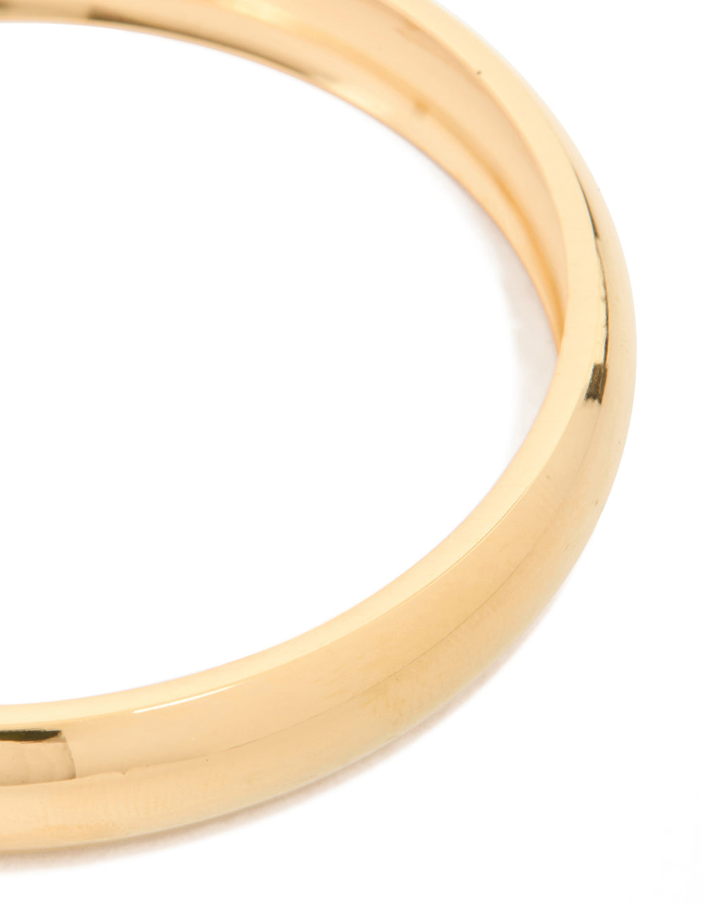 Crafted from waterproof gold plated stainless steel, this round smooth bangle in close up view