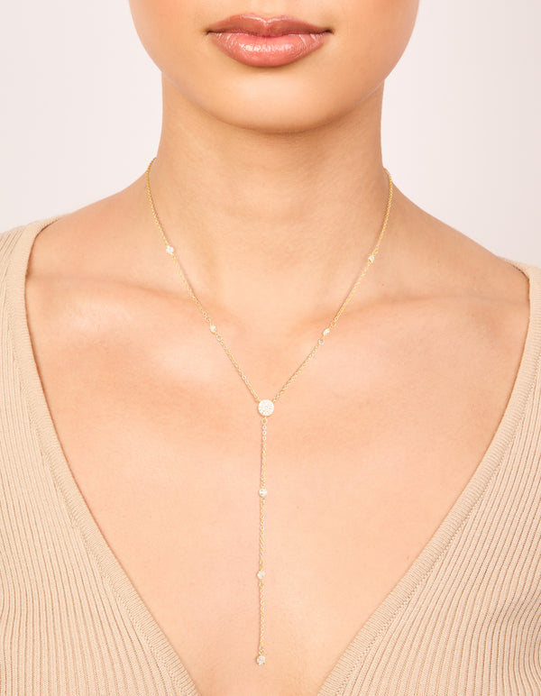 Showcasing a gold plated cubic zirconia Y-necklace on neck view