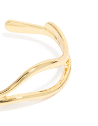 Showcasing gold plated organic open wave wrist cuff in close up view - link has visual effect only