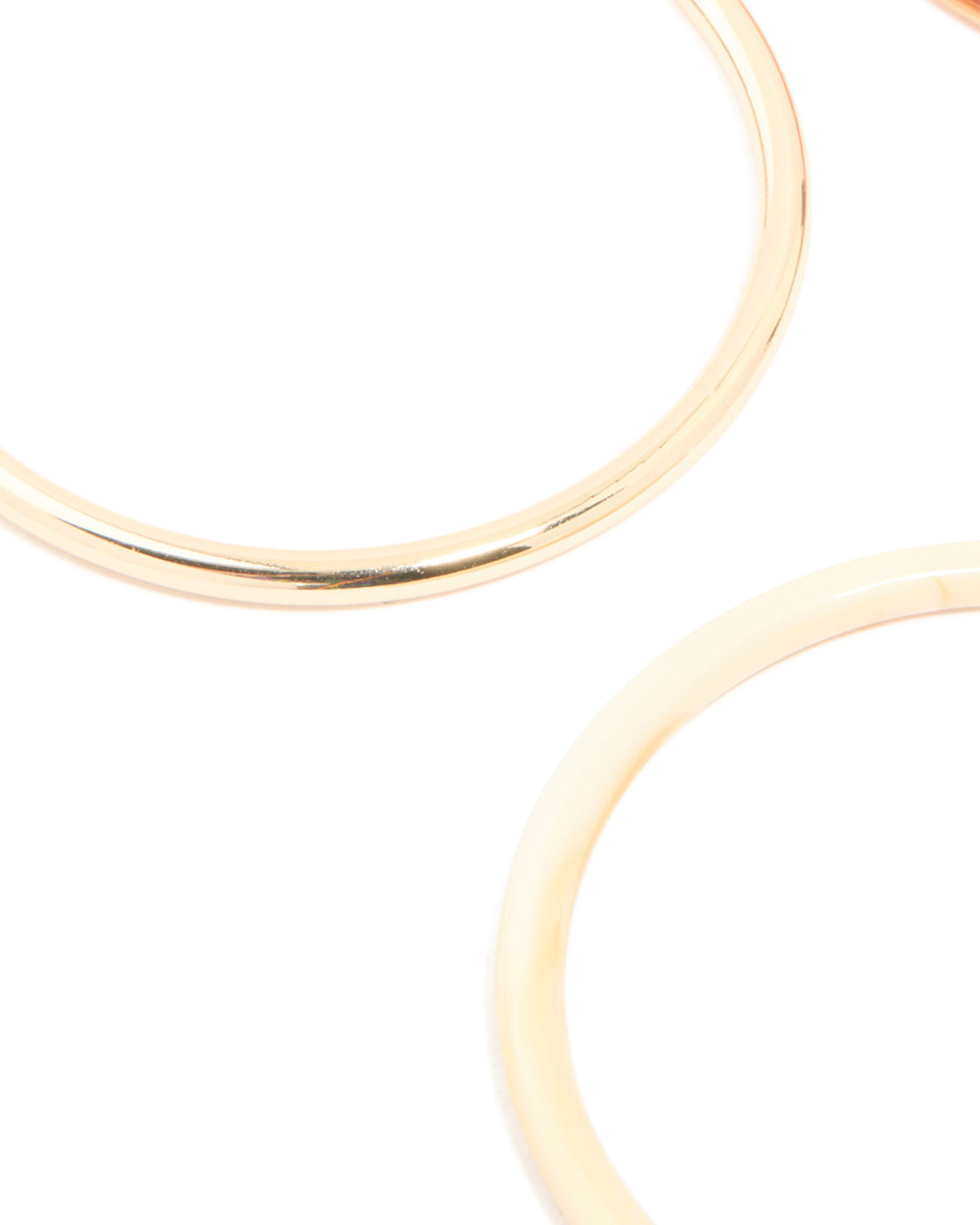 Featuring mixed acrylic bangles 4-pack in gold close up view
