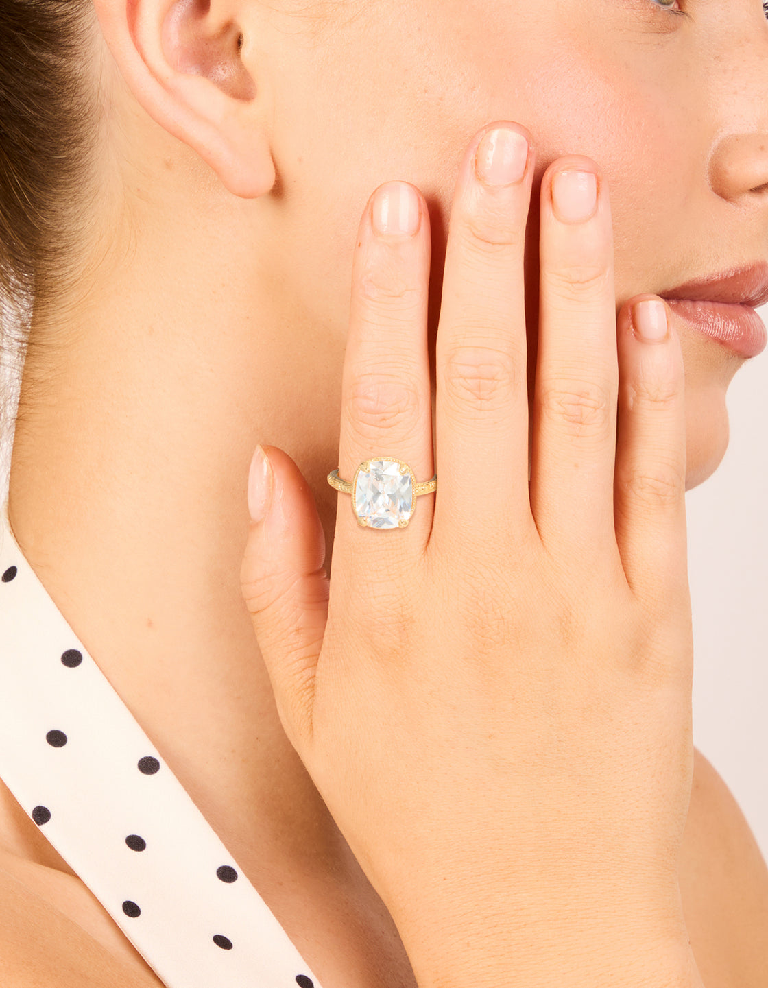Featuring a gold plated vintage cubic zirconia ring with crystal and statement design on finger view