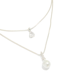 Discover a silver plated double layered cubic zirconia and pearl necklace close up view - link has visual effect only