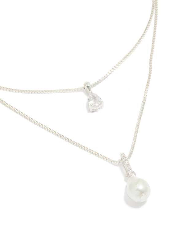 Discover a silver plated double layered cubic zirconia and pearl necklace close up view