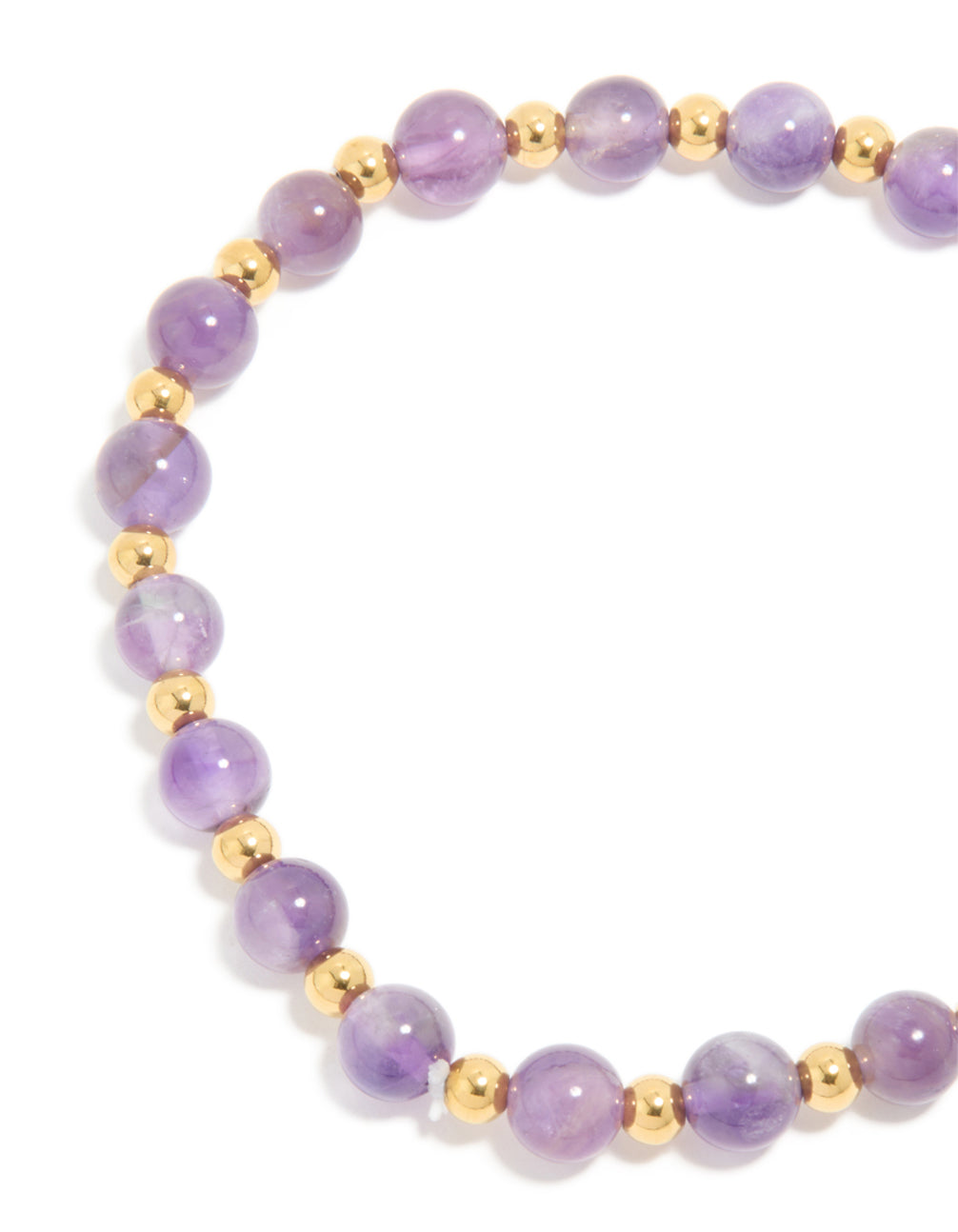 Highlighting the beaded design of waterproof stretch bracelet in amethyst semi precious stone with gold plated stainless steel closure detail view