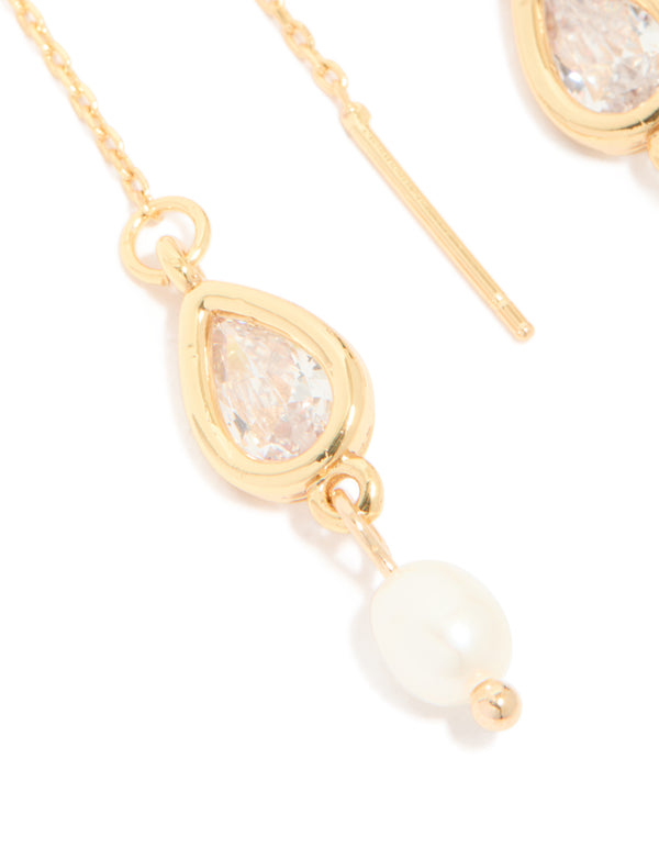 Designed with gold plated freshwater pearl and cubic zirconia threader drop earrings close up view