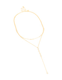 Discover this cubic zirconia bezel layered Y-necklace featuring ball details in gold plated finish with dainty statement design close up view - link has visual effect only
