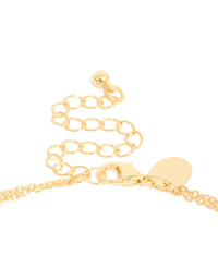 Highlighting the cubic zirconia bezel layered Y-necklace with ball features and gold plated construction in dainty statement style clasp detail view - link has visual effect only