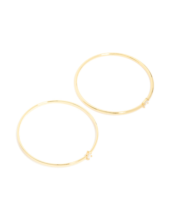Featuring gold plated cubic zirconia rectangle and teardrop bangles in a 2-pack accents front view