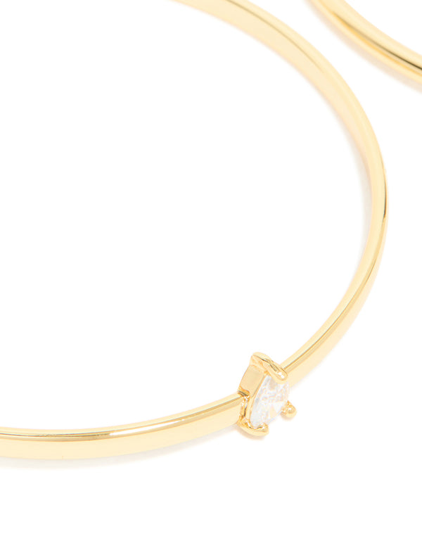 Showcasing gold plated cubic zirconia rectangle and teardrop bangles in a 2-pack accents close up view