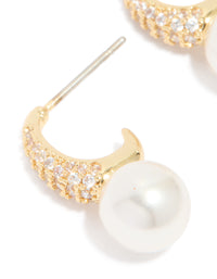 Highlighting gold plated cubic zirconia and pearl small pave open hoop earrings close up view - link has visual effect only