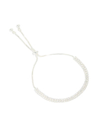 Featuring a silver plated cubic zirconia thin tennis layered toggle bracelet front view - link has visual effect only