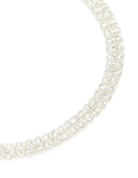 Crafted from silver plated cubic zirconia thin tennis layered toggle bracelet close up view - link has visual effect only