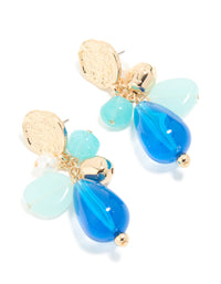 Crafted from gold textured and blue beaded drop earrings with charms featuring statement style front view - link has visual effect only