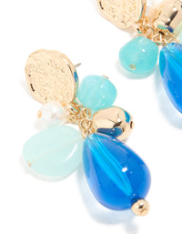 Designed with gold textured and blue beaded drop earrings featuring coin in statement style close up view - link has visual effect only