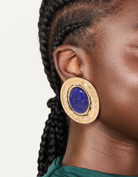 Featuring worn gold round hammered dark blue acrylic stud earrings with statement style on ear view - link has visual effect only