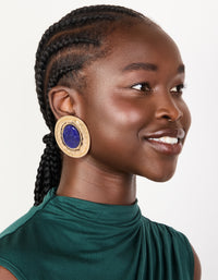 Crafted from worn gold with round hammered dark blue acrylic stud earrings in statement style on model view - link has visual effect only