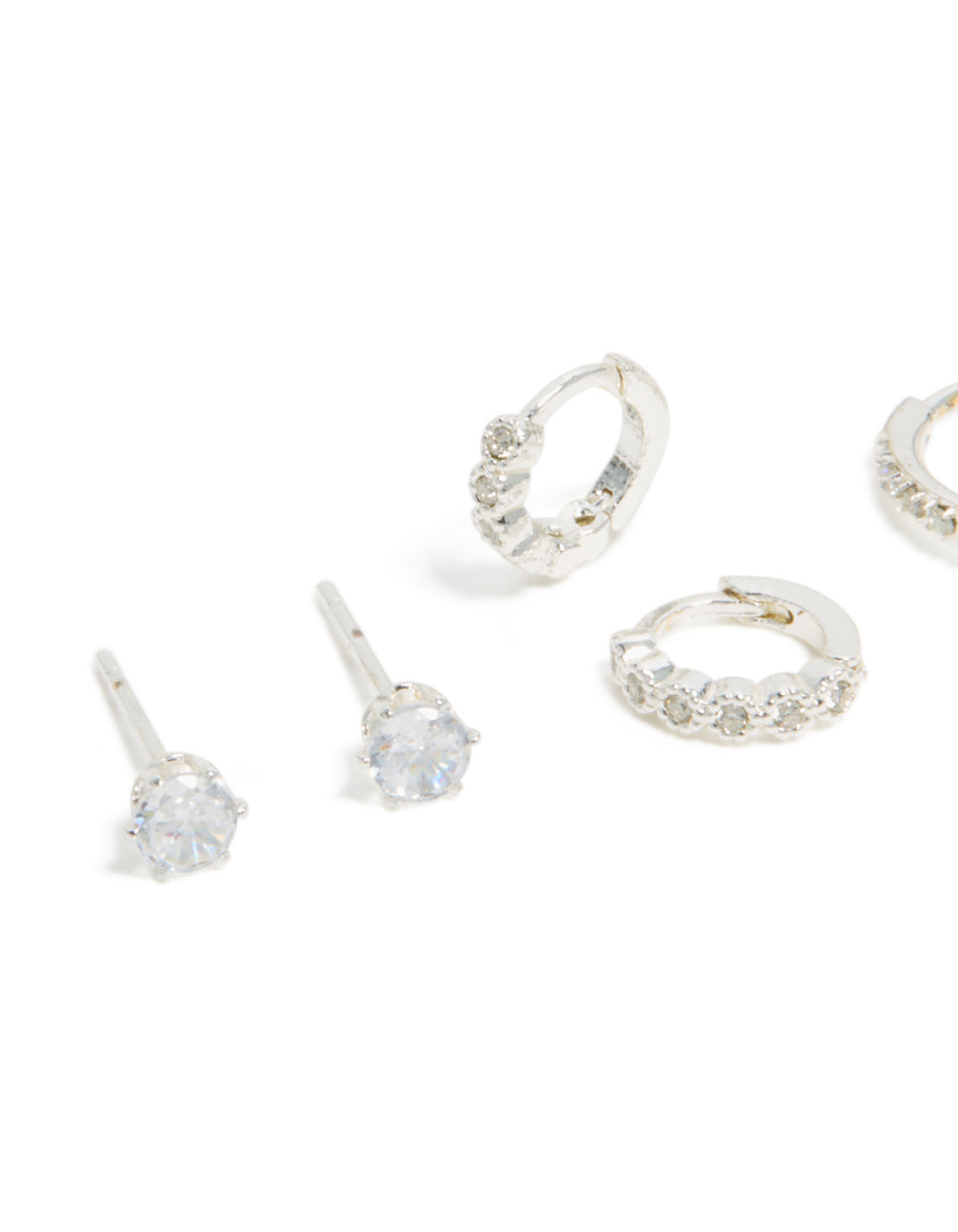 Showcasing waterproof stainless steel cubic zirconia stud and huggie earrings in a 3-pack with charm silver white detail