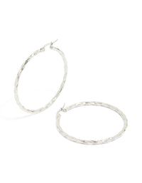 Showcasing surgical steel textured hoop earrings in 40 MM with silver closure front view - link has visual effect only