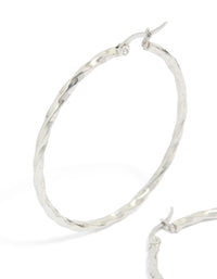 Featuring surgical steel textured hoop earrings in 40 MM with silver closure close up view - link has visual effect only