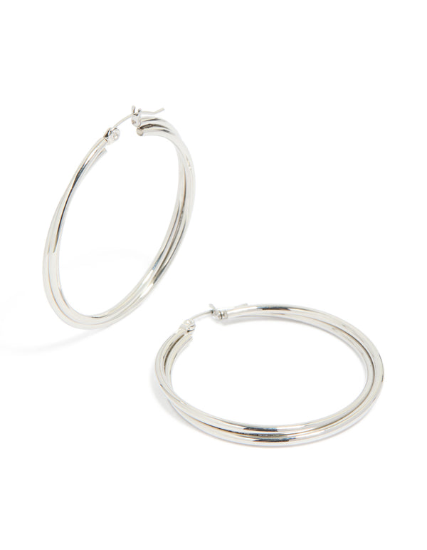 Showcasing surgical steel crossover hoop earrings in silver front view