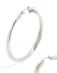 These surgical steel crossover hoop earrings in silver highlight close up view - link has visual effect only