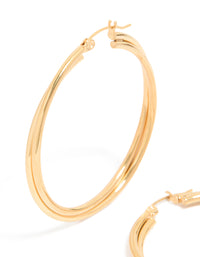Featuring gold plated surgical steel crossover hoop earrings with 40 MM diameter close up view - link has visual effect only