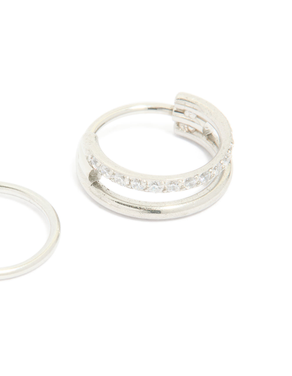 Designed with surgical steel cubic zirconia hinged and simple nose rings in a 2-pack with diamond accents and statement style close up view