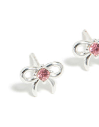 Beautifully crafted stud earrings for kids with waterproof stainless steel, bow feature and pink cubic zirconia in a close up view - link has visual effect only