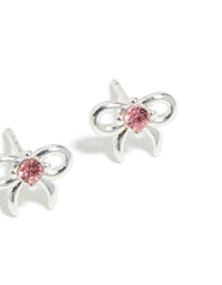 Featuring kids stud earrings made with waterproof stainless steel, bow feature and pink cubic zirconia in a post detail view - link has visual effect only