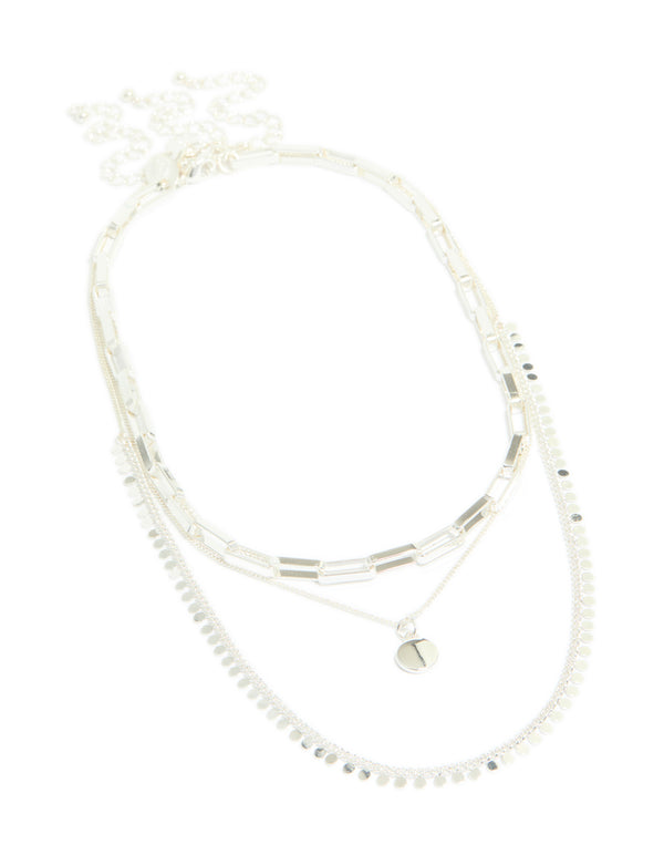 Featuring a disc chain layered necklace in silver plated material with statement style close up view
