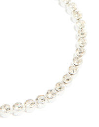 Highlighting the silver plated diamante tennis bracelet with detailed view of individual stone settings close up view - link has visual effect only