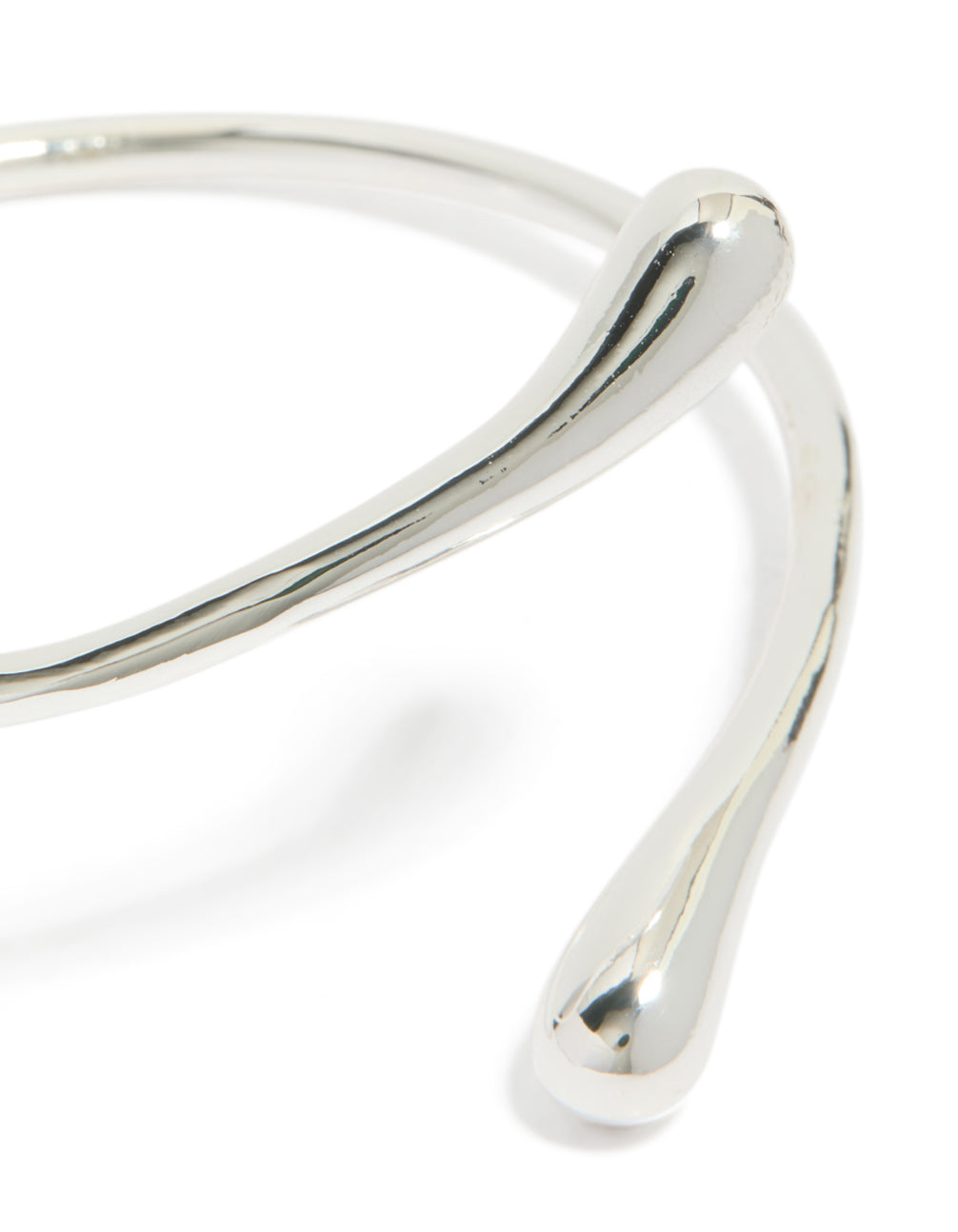 Stunning teardrop wrap around bangle crafted from silver plated material close up view