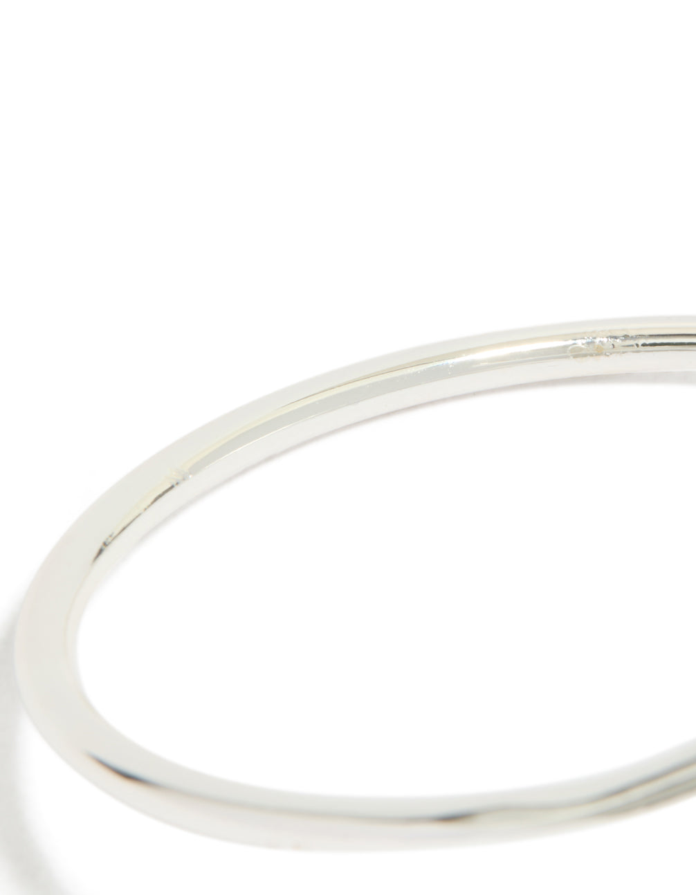 Stunning teardrop wrap around bangle crafted from silver plated material close up view
