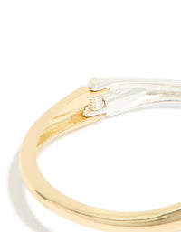 Designed with mixed metal plating in gold and silver, this wrap around bangle highlights hinged in closure detail view - link has visual effect only