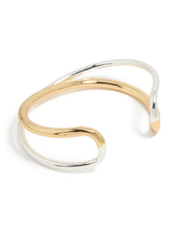 Showcasing a mixed metal open crossover wrist cuff crafted from gold plated and silver materials in a bangle style front view - link has visual effect only