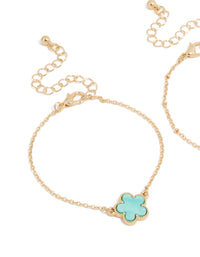 Featuring a 2-pack of bracelets with floral in gold and turquoise close up view - link has visual effect only