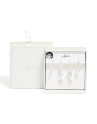 Showcasing silver plated cubic zirconia mixed stud and huggie earrings in a 4 pack front view - link has visual effect only