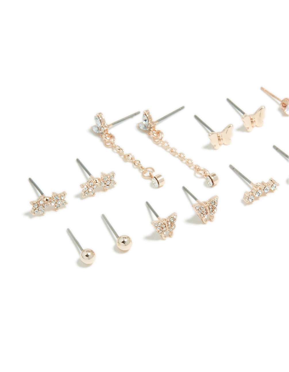 Showcasing an 8-pack of stud earrings with butterfly, chain, celestial star, and pearl designs in rose gold close up view