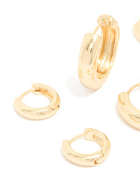 Close up view of gold plated thick hoop earrings 3-pack highlighting polished finish - link has visual effect only
