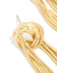 Designed with a knot stud, these gold plated statement fringe earrings close up view - link has visual effect only