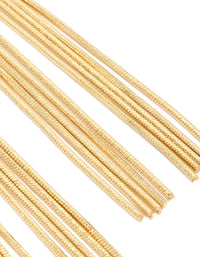 Designed with a knot stud, these gold plated statement fringe earrings close up view - link has visual effect only