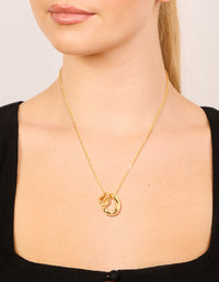 Showcasing a gold plated small double organic charm necklace with pendant on neck view - link has visual effect only
