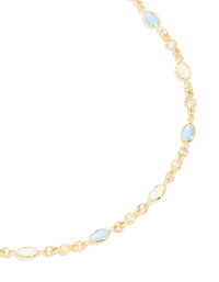 Crafted from gold plated material, this blue and white oval cubic zirconia necklace in dainty style close up view - link has visual effect only