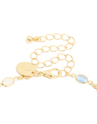 Highlighting the blue and white oval cubic zirconia set in the gold plated necklace clasp detail view - link has visual effect only