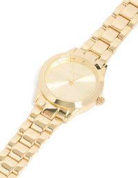 Featuring roman numeral numbers with gold dial round shape formal analog link-band strap in gold plated statement watch for women watch face dial view - link has visual effect only