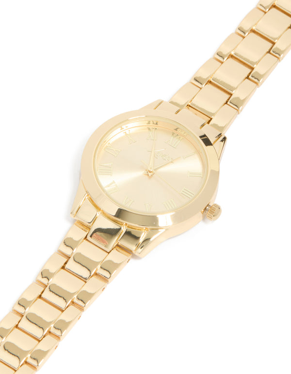Featuring roman numeral numbers with gold dial round shape formal analog link-band strap in gold plated statement watch for women watch face dial view